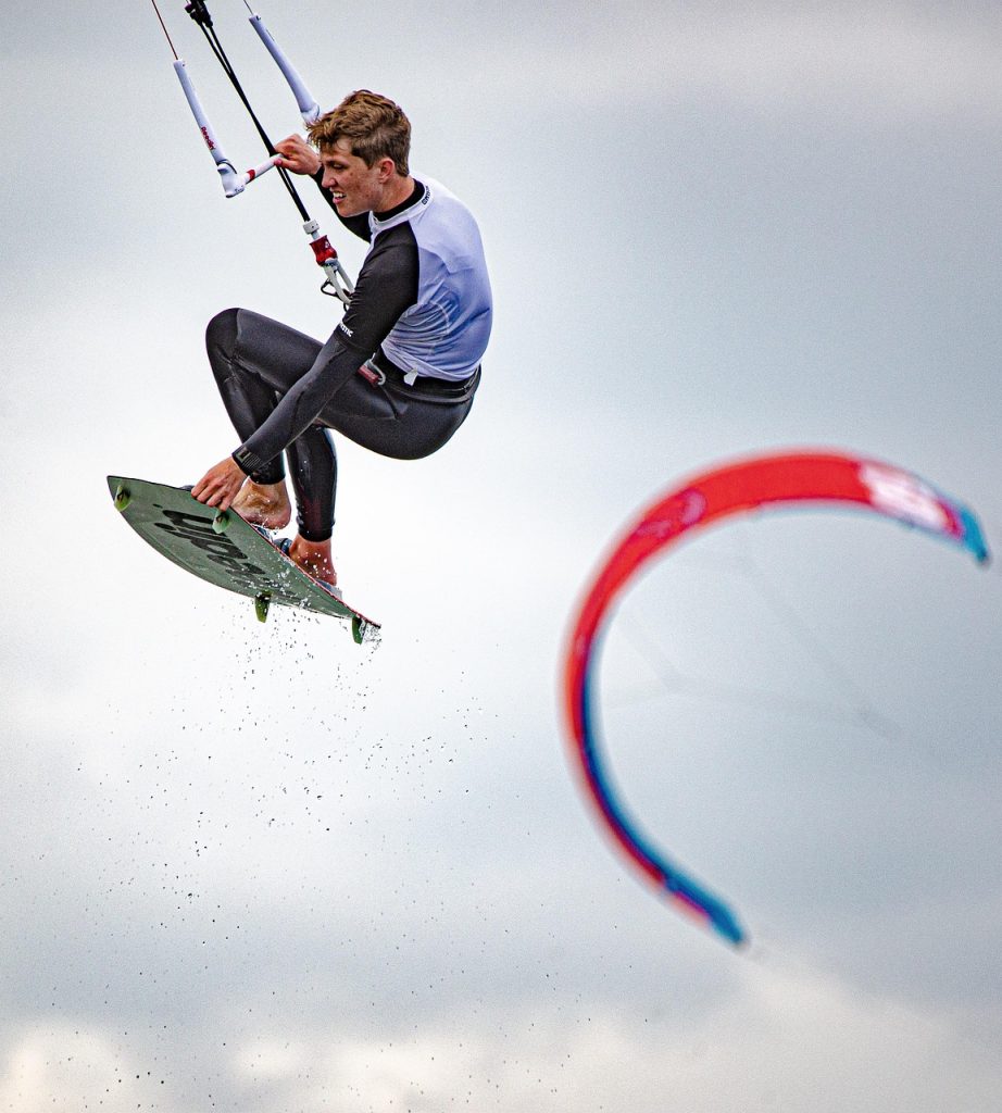 kitesurfing, flying, surfer, kite surfer, kiteboarding, sports, water sports, athletic, adventure, leisure, recreation, activity